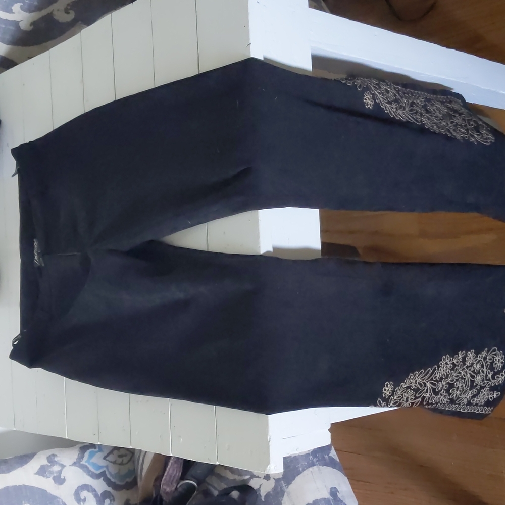 Embroidered flare pants.